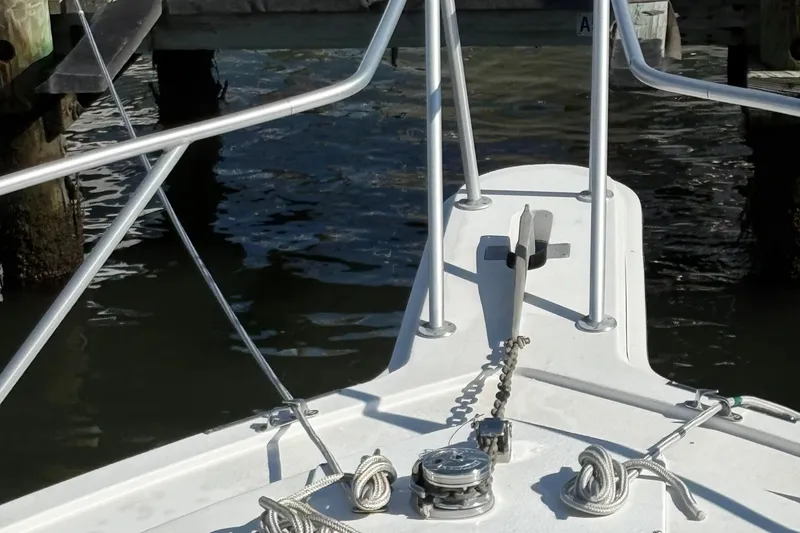 Slide: The Image of 1988 Egg Harbor 37 Convertible boat helm with steering wheel and Cummins turbo diesel controls. - 34