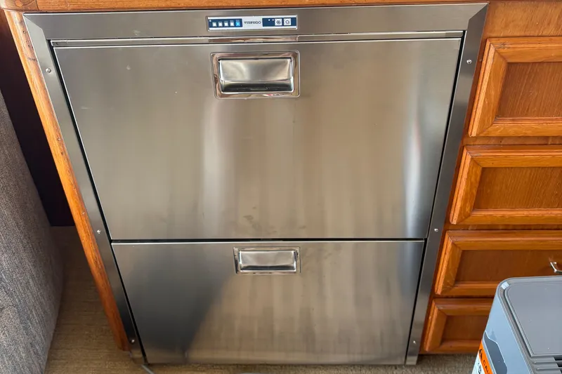 Slide: The Image of Engine compartment of a 1988 Egg Harbor 37 Convertible boat, showing wiring and components. - 49