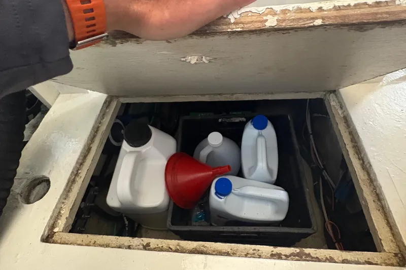 Slide: The Image of Engine room of 1988 Egg Harbor 37 Convertible with fuel filters and marine fluid. - 52