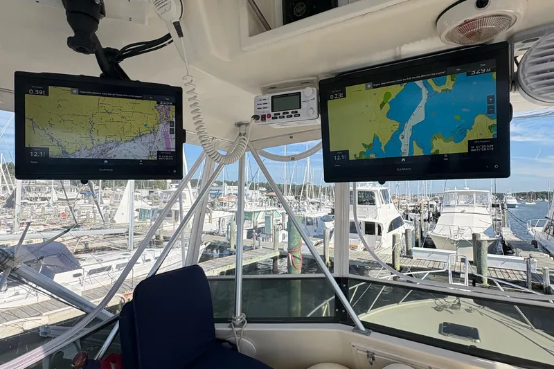 Slide: The Image of Engine room of 1988 Egg Harbor 37 Convertible with coolant reservoir and hoses. - 58