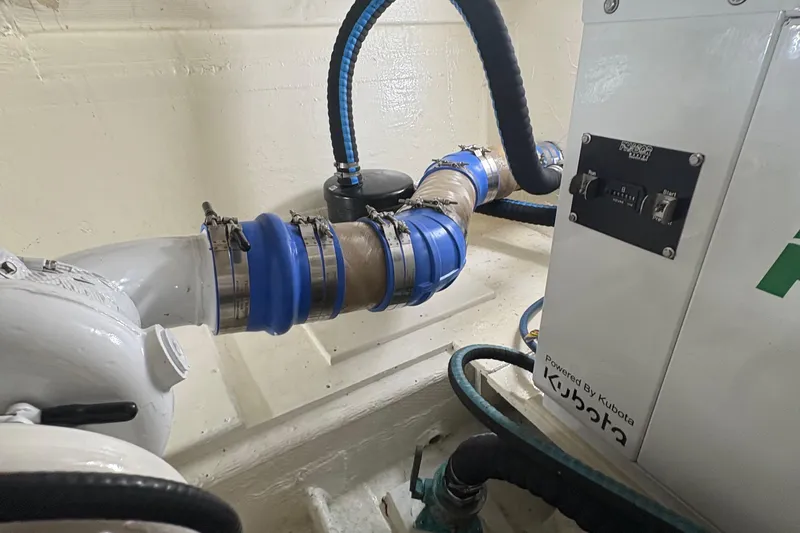 Slide: The Image of 1988 Egg Harbor 37 Convertible yacht named "Monkey Business" docked at a marina. - 9