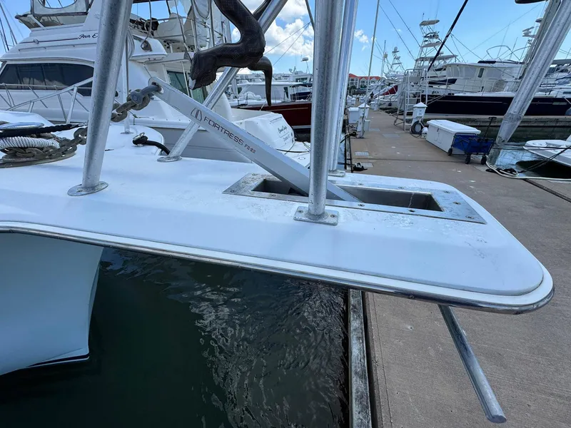 Slide: The Image of 1998 Ocean Yachts 40 Super Sport docked, showcasing anchor and bow details. - 12