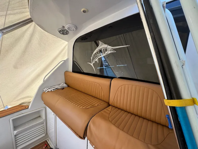 Slide: The Image of 1998 Ocean Yachts 40 Super Sport interior with tan leather seating and marlin decal. - 17