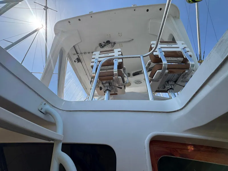 Slide: The Image of 1998 Ocean Yachts 40 Super Sport flybridge view with chairs and clear sky. - 20