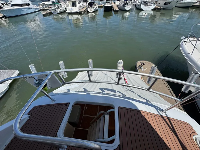 Slide: The Image of 1998 Ocean Yachts 40 Super Sport docked at marina, view from deck. - 25