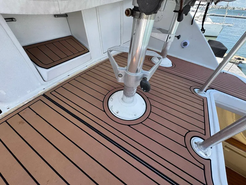 Slide: The Image of 1998 Ocean Yachts 40 Super Sport deck with wood finish and metal fixtures. - 27