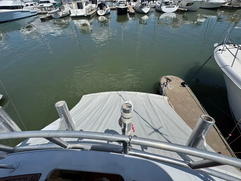 Slide: The Image of 1998 Ocean Yachts 40 Super Sport docked in a marina, view from the deck. - 28