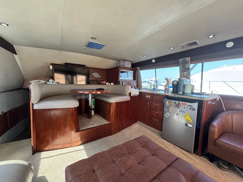 Slide: The Image of Interior of 1998 Ocean Yachts 40 Super Sport with cozy seating and kitchenette. - 32