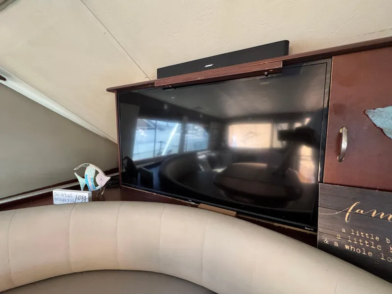 Slide: The Image of Interior of 1998 Ocean Yachts 40 Super Sport with TV and cozy seating area. - 33