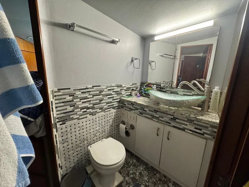 Slide: The Image of Bathroom interior of 1998 Ocean Yachts 40 Super Sport with modern sink and mosaic tiles. - 40