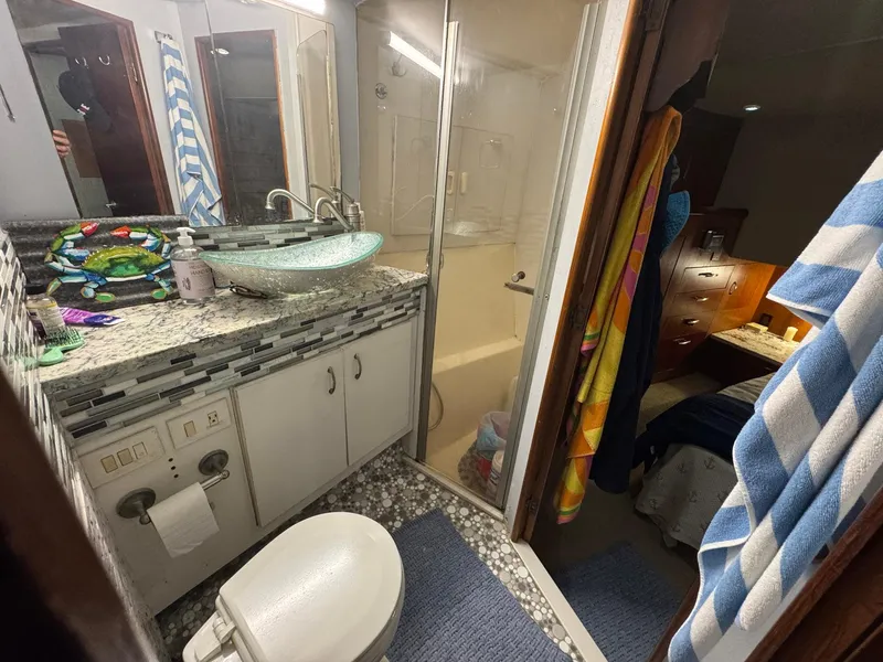 Slide: The Image of Bathroom interior of 1998 Ocean Yachts 40 Super Sport with modern sink and shower. - 41