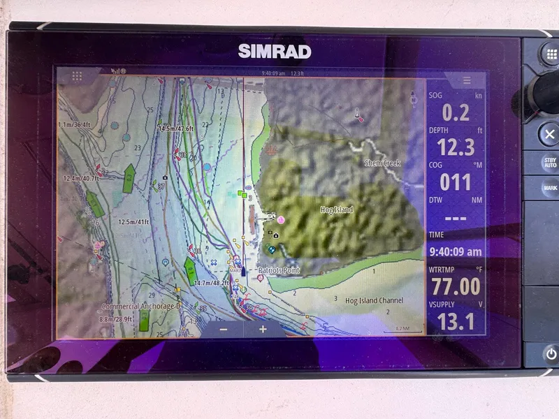 Slide: The Image of Simrad marine GPS display on 1998 Ocean Yachts 40 Super Sport, showing navigation data and map. - 42