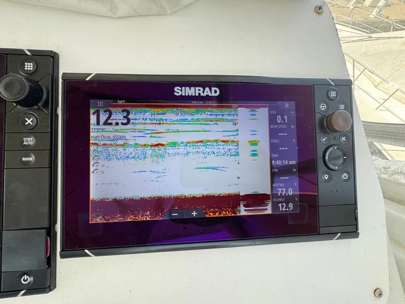Slide: The Image of Simrad marine display on 1998 Ocean Yachts 40 Super Sport dashboard. - 43