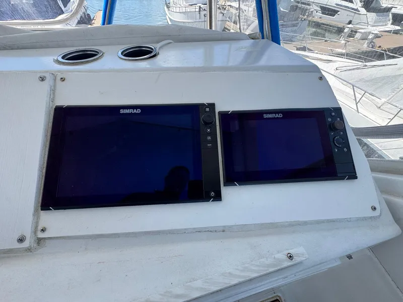 Slide: The Image of Control panel of a 1998 Ocean Yachts 40 Super Sport with Simrad displays. - 44