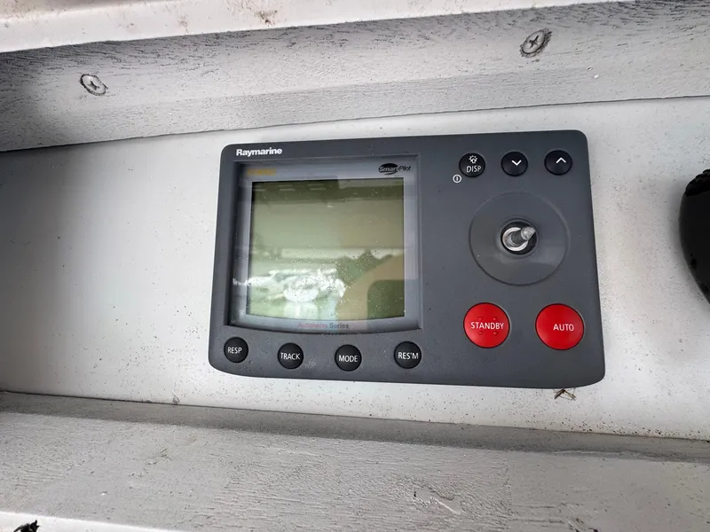 Slide: The Image of Raymarine navigation system on 1998 Ocean Yachts 40 Super Sport boat dashboard. - 47