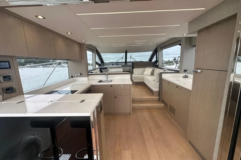 Slide: The Image of Luxurious interior of 2018 Sunseeker Manhattan 52 yacht with modern kitchen and seating area. - 17