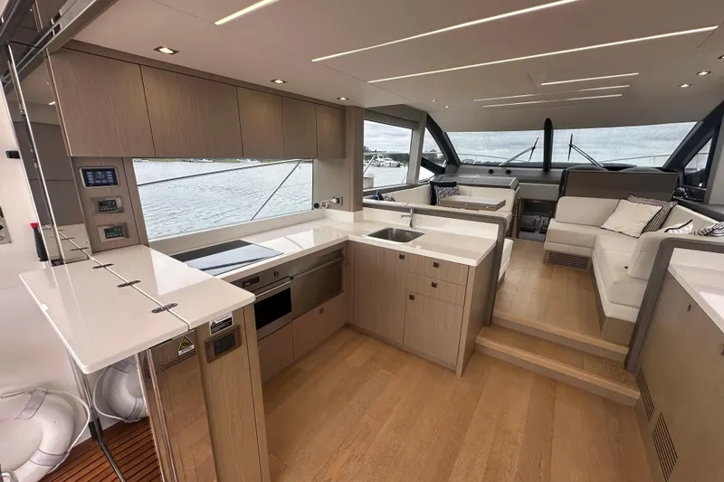 Slide: The Image of Luxurious interior of 2018 Sunseeker Manhattan 52 yacht with modern kitchen and seating area. - 18