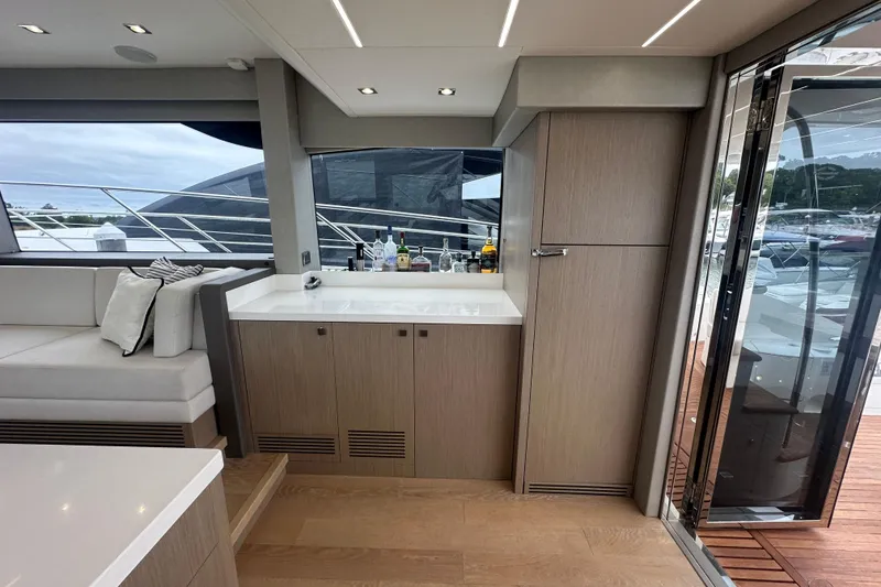 Slide: The Image of Luxurious interior of 2018 Sunseeker Manhattan 52 yacht with modern cabinetry and seating. - 22