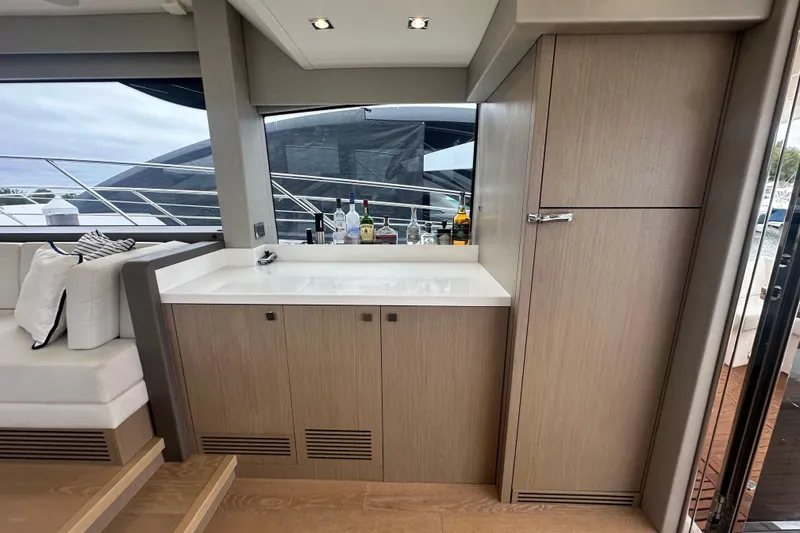 Slide: The Image of Luxurious interior of 2018 Sunseeker Manhattan 52 yacht with modern cabinetry and seating. - 23