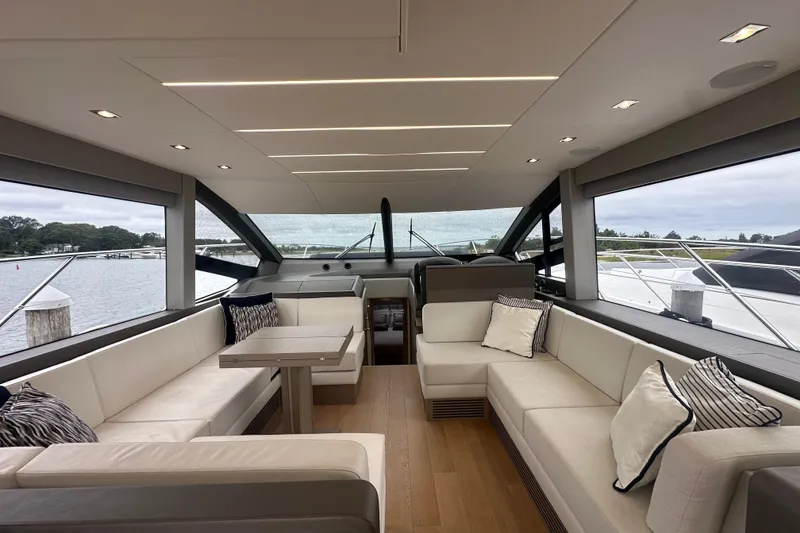 Slide: The Image of Luxurious interior of 2018 Sunseeker Manhattan 52 yacht with elegant seating and panoramic windows. - 24