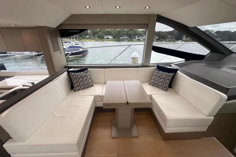 Slide: The Image of Luxurious interior of 2018 Sunseeker Manhattan 52 yacht with elegant seating and scenic view. - 26