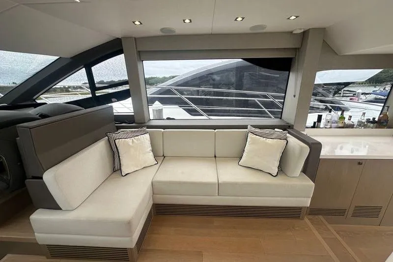 Slide: The Image of Luxurious interior of 2018 Sunseeker Manhattan 52 yacht with elegant seating and large windows. - 29