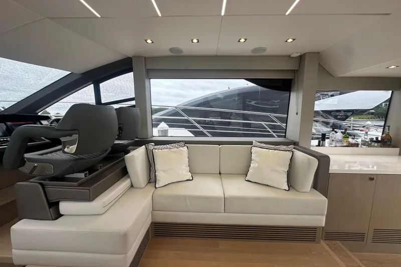 Slide: The Image of Luxurious interior of 2018 Sunseeker Manhattan 52 yacht with modern seating and large windows. - 30