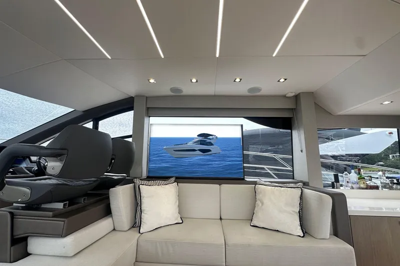 Slide: The Image of Luxurious interior of 2018 Sunseeker Manhattan 52 yacht with modern seating and large windows. - 31