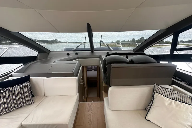 Slide: The Image of Interior view of 2018 Sunseeker Manhattan 52 yacht, featuring elegant seating and panoramic windows. - 32