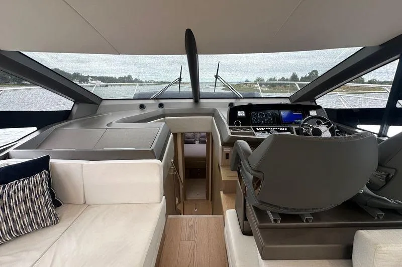 Slide: The Image of Interior of 2018 Sunseeker Manhattan 52 yacht, featuring modern helm and luxurious seating. - 33