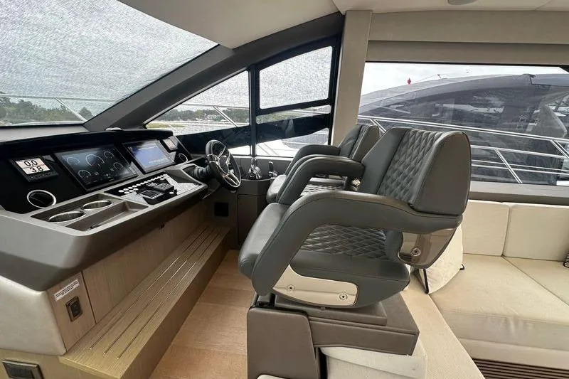 Slide: The Image of Interior helm of 2018 Sunseeker Manhattan 52 yacht with modern controls and seating. - 34