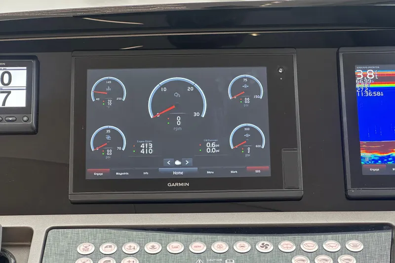 Slide: The Image of Garmin display on 2018 Sunseeker Manhattan 52 yacht dashboard, showing engine metrics and navigation data. - 38