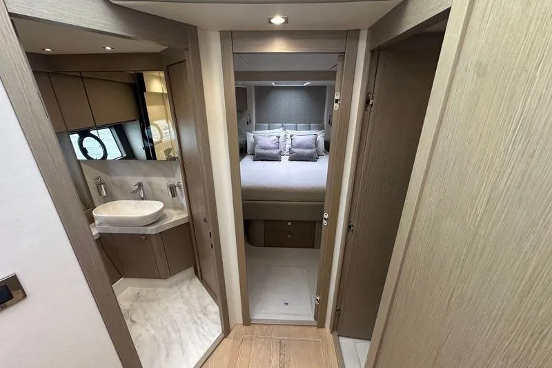 Slide: The Image of Luxurious interior of 2018 Sunseeker Manhattan 52 yacht, featuring bedroom and bathroom. - 41