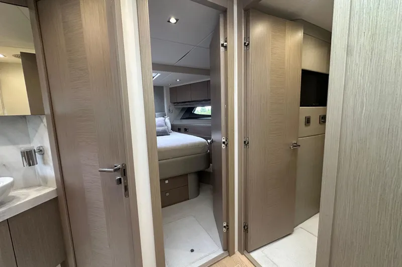 Slide: The Image of Luxurious interior of 2018 Sunseeker Manhattan 52 yacht, featuring bedroom and bathroom. - 42