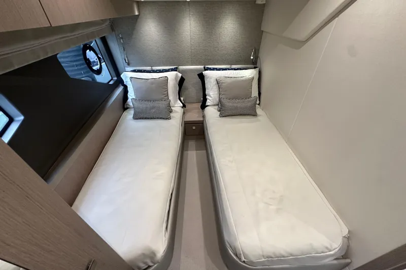 Slide: The Image of Twin cabin in 2018 Sunseeker Manhattan 52 yacht, featuring modern design and cozy bedding. - 51