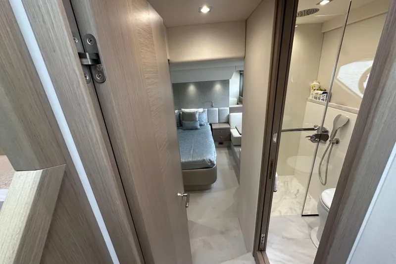 Slide: The Image of Luxurious interior of 2018 Sunseeker Manhattan 52 yacht, featuring bedroom and modern bathroom. - 54