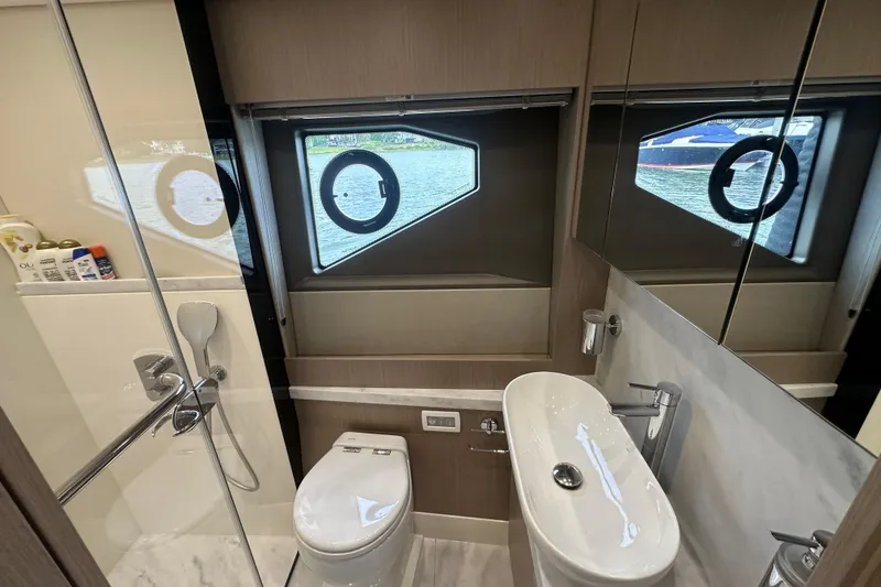 Slide: The Image of Luxurious bathroom in 2018 Sunseeker Manhattan 52 yacht with modern fixtures and window view. - 55