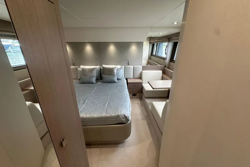 Slide: The Image of Luxurious interior of 2018 Sunseeker Manhattan 52 yacht with elegant bedroom and seating area. - 56