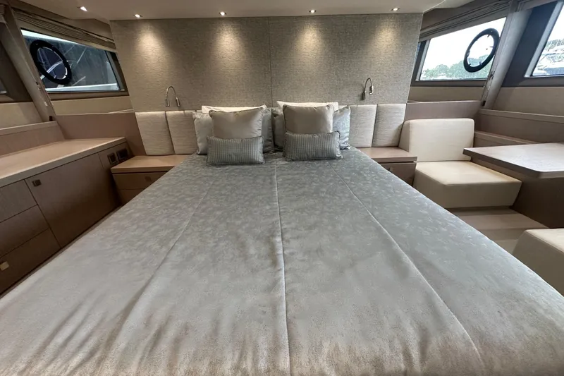 Slide: The Image of Luxurious bedroom interior of 2018 Sunseeker Manhattan 52 yacht with elegant bedding and seating. - 58
