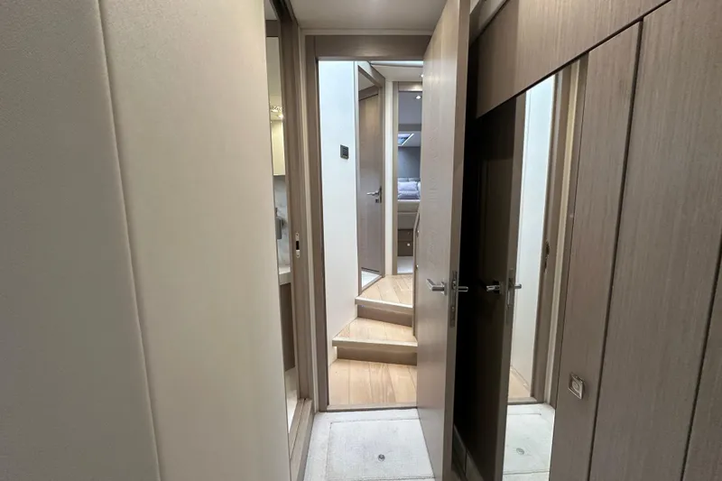 Slide: The Image of Interior hallway of 2018 Sunseeker Manhattan 52 yacht, featuring modern wood finishes. - 63