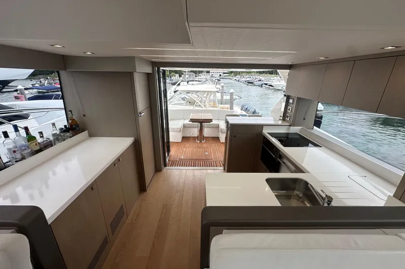 Slide: The Image of Luxurious interior of 2018 Sunseeker Manhattan 52 yacht with modern kitchen and scenic marina view. - 66