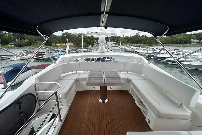 Slide: The Image of Luxurious 2018 Sunseeker Manhattan 52 yacht with spacious deck and elegant seating area. - 82