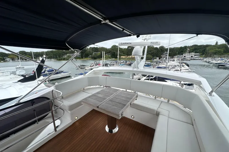 Slide: The Image of Flybridge view of 2018 Sunseeker Manhattan 52 yacht docked at marina. - 84