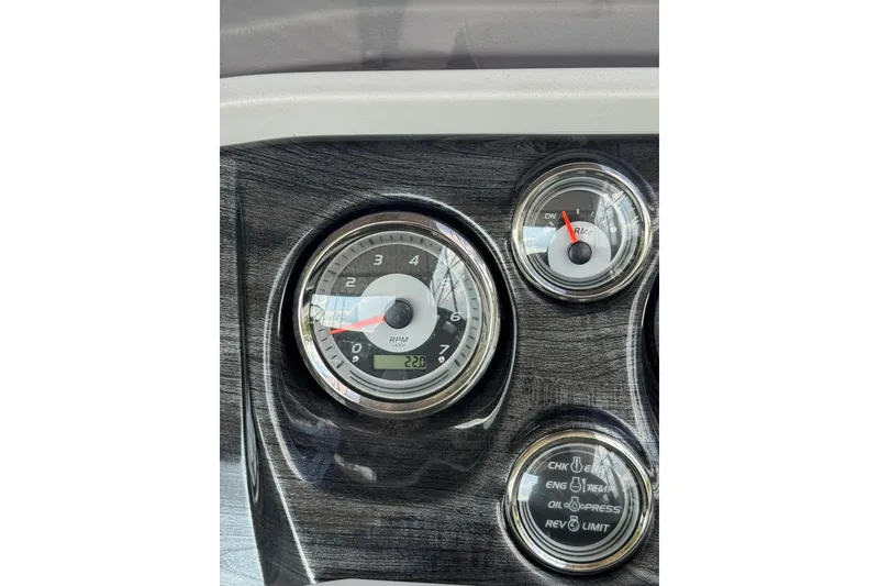 Slide: The Image of Close-up of 2021 Avalon LSZ Entertainer dashboard gauges, showing RPM and trim indicators. - 12