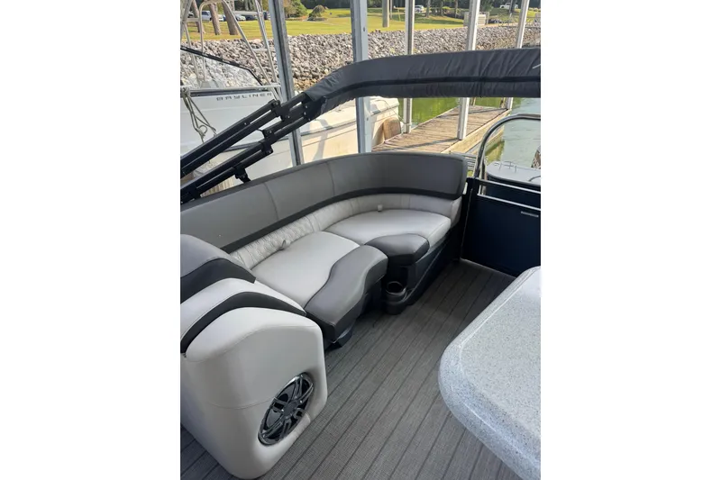 Slide: The Image of 2021 Avalon LSZ Entertainer 24' boat interior with plush seating and modern design. - 5