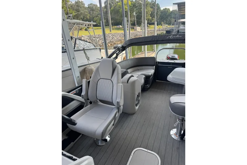Slide: The Image of 2021 Avalon LSZ Entertainer 24' boat interior with plush seating and modern design. - 7