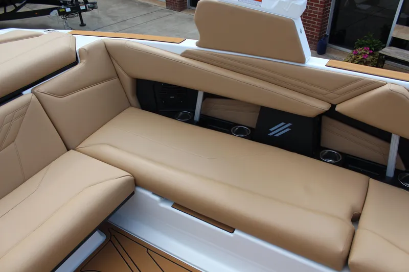 Slide: The Image of 2026 ATX Surf Boats 22 Type-S interior with tan leather seating and cup holders. - 11