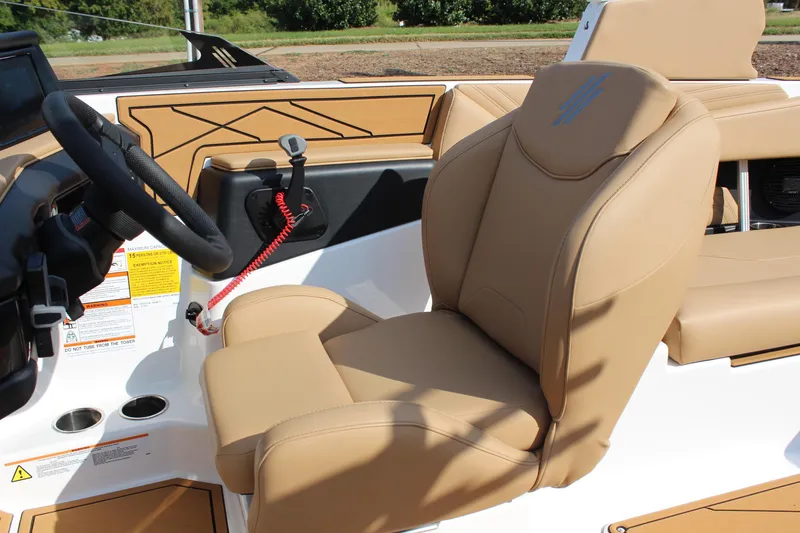 Slide: The Image of 2026 ATX Surf Boats 22 Type-S interior with tan leather seating and modern controls. - 16