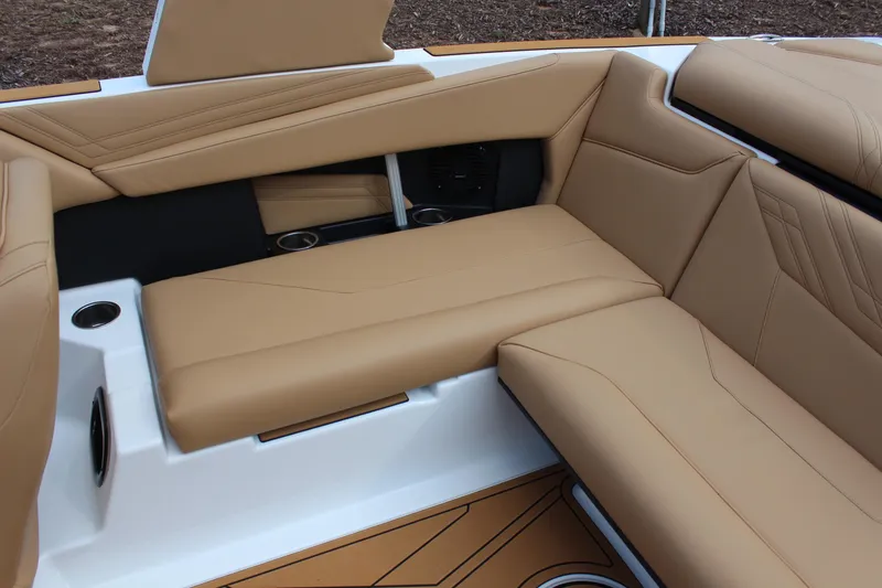 Slide: The Image of 2026 ATX Surf Boats 22 Type-S interior with tan leather seating and cup holders. - 9