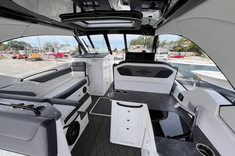 Slide: The Image of Luxurious interior of 2025 Fountain 39 DX boat with modern seating and sleek design. - 14